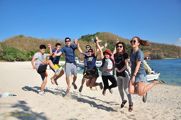 Group of friends on a jumpshot along the beach